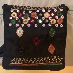 Tiny black bag withVelcro closure